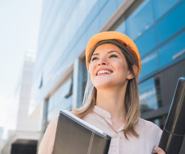 portrait-professional-architect-woman-wearing-yellow-helmet-standing-outdoors-engineer-architect-concept-scaled-1-1